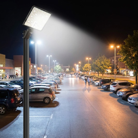 LED area light illuminating a parking lot at night
